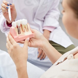 Dental implant components displayed for patient