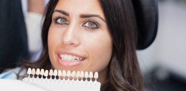 Woman trying on veneers from her cosmetic dentist in Heber City