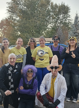 TimberRidge Dental team members smiling outdoors in holiday attire