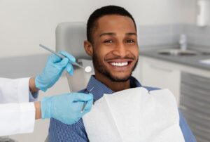 Man smiling at the dentist